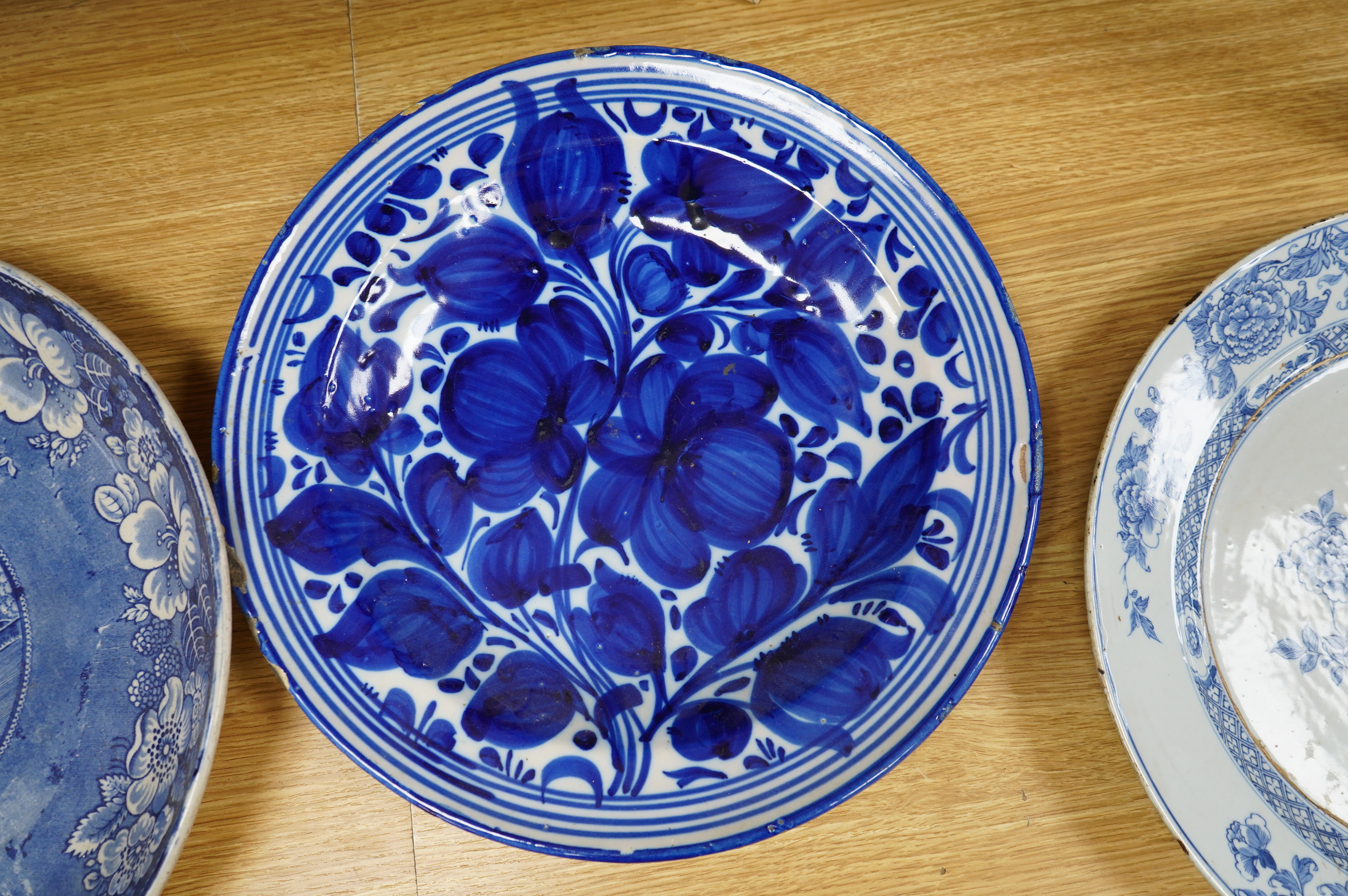 A 18th century delftware charger, another later, a Victorian Briar Rose earthenware dish and a Chinese dish, largest 35cm Condition - poor